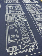 Top-down view of a fire truck blueprint, precise white line art on navy paper by Plotora
