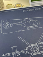 Eurocopter EC135 side view with Fenestron tail rotor, pen plotter blueprint in white ink on navy paper