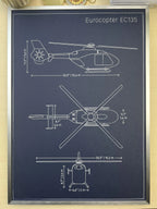 Framed Eurocopter EC135 helicopter blueprint showing side, top and front views, silver metal frame